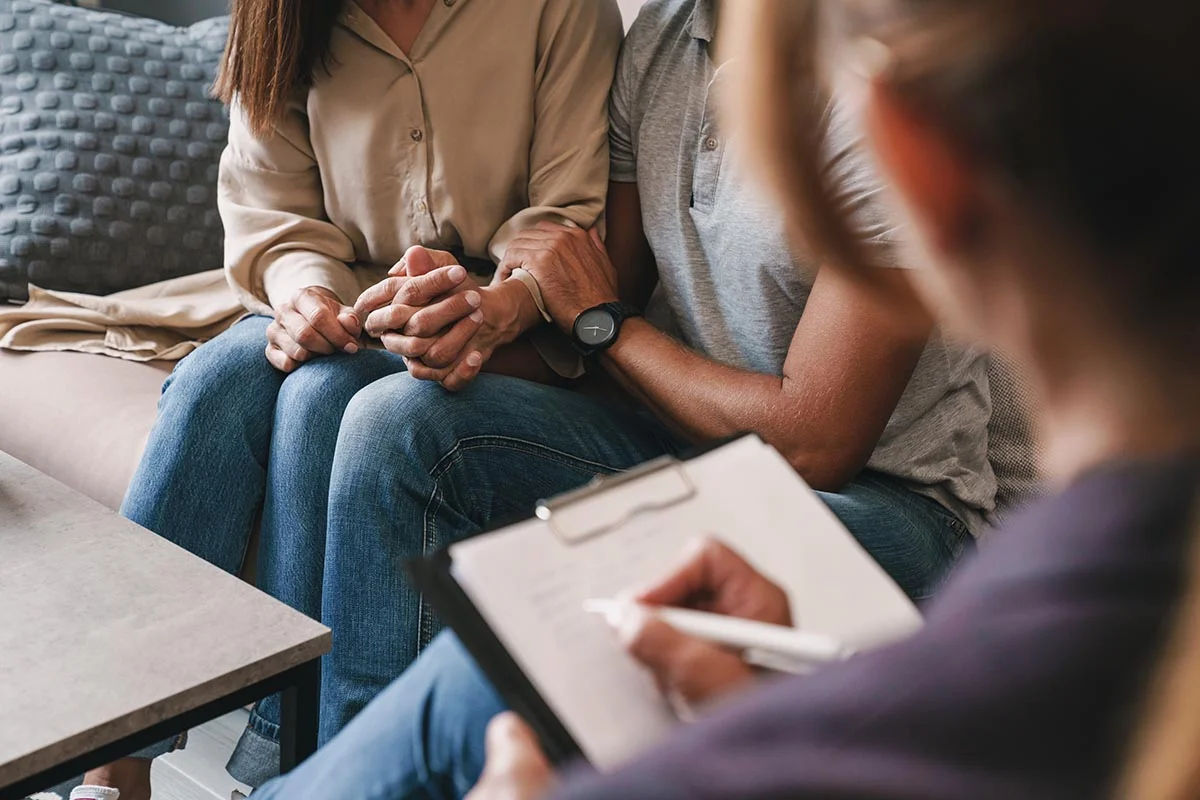 a family does a fun activity in family therapy
