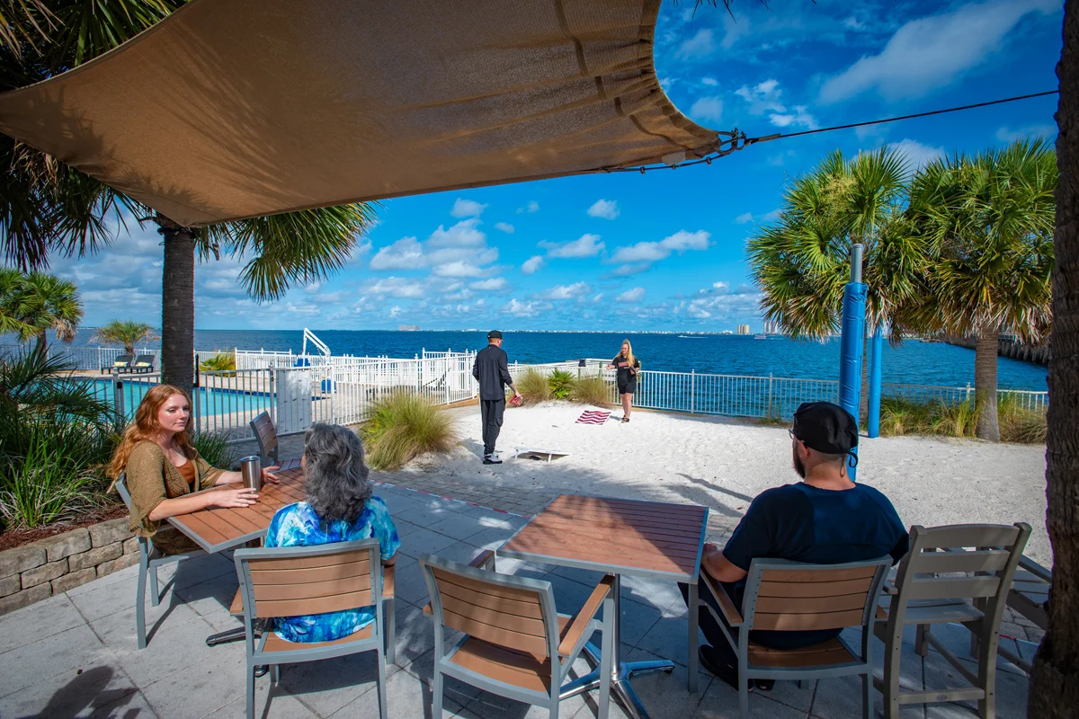 People sitting on balcony with ocean view