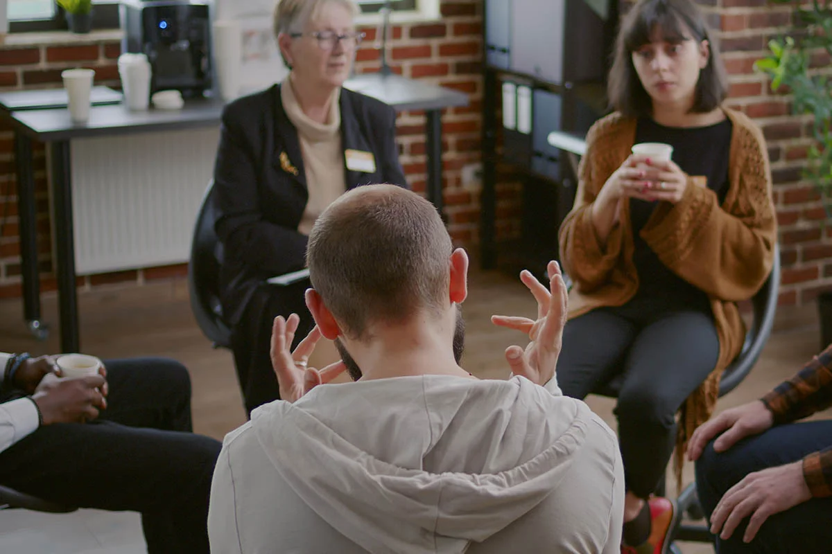 People gathering and pondering the question