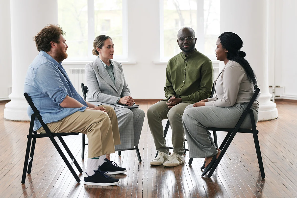 Several people in an addiction aftercare program