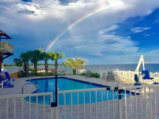 michael neill|books by michael neill|Gulf Breeze Recovery facility|image of rainbow over waterside exterior of Gulf Breeze Recovery's facility