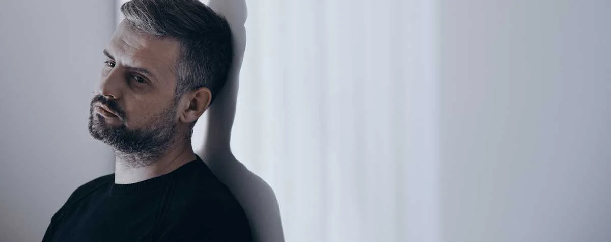 image of addicted man home alone