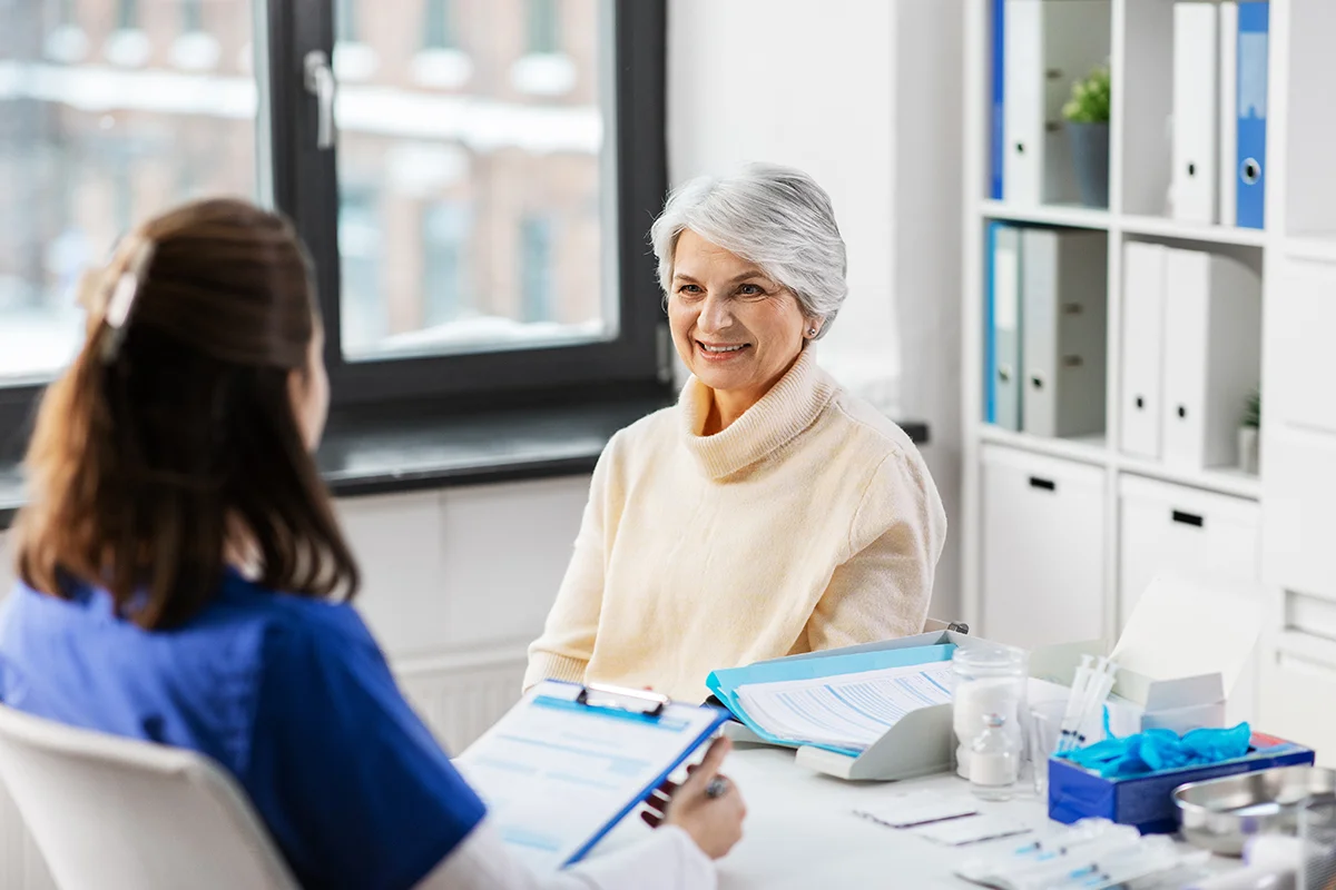 Woman speaking to health professional
