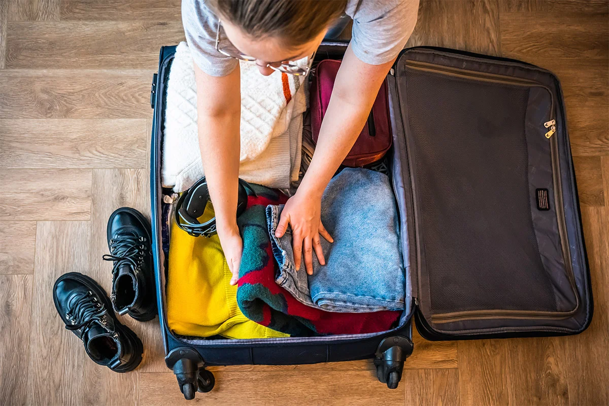 Woman packing her suitcase