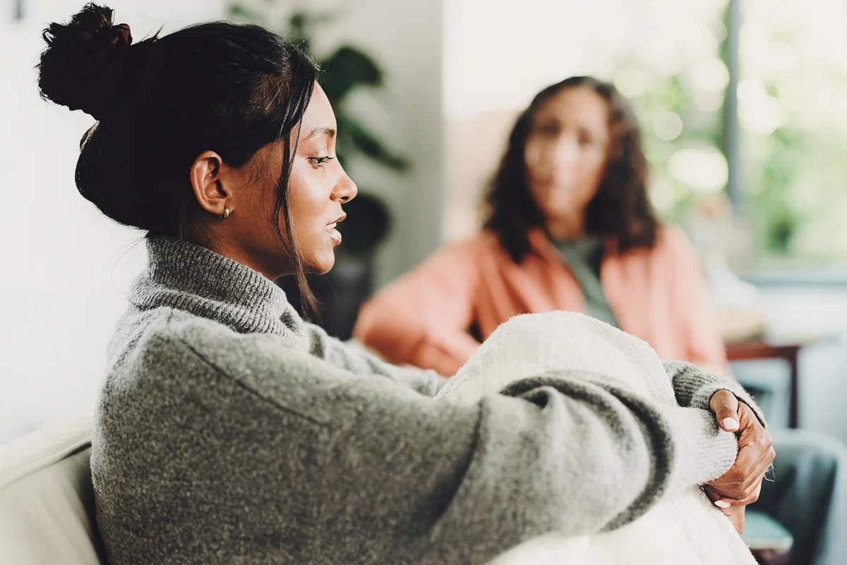 Woman speaking to counselor in office